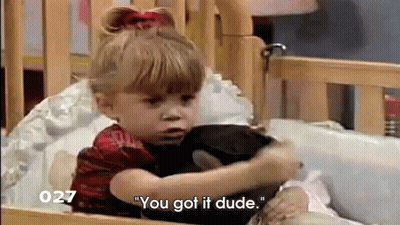 Little Girl Sitting In Crib Saying You Got It Dude GIF