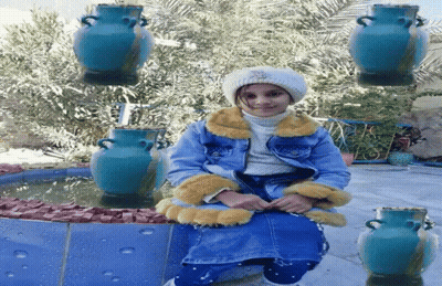 Little Girl Sitting In Front Of Fountain GIF