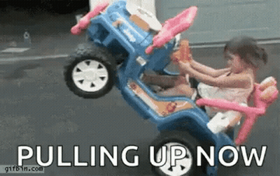 Little Girl Sitting In Toy Car Pulling Up Now GIF