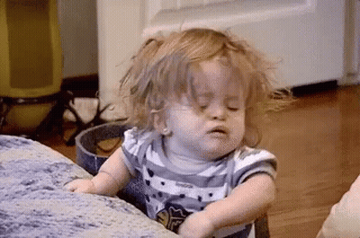 Little Girl Sitting On Couch Eyes Closed GIF