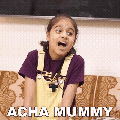 Little Girl Sitting On Couch Mouth Open Acha Mummy GIF