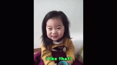 Little Girl Sitting Smiling With Cup GIF