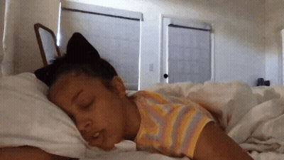 Little Girl Sleeping With Cat Ear On Head GIF