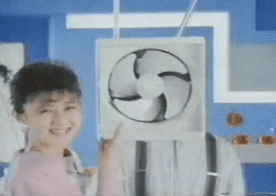 Little Girl Smiling Holding Fan GIF