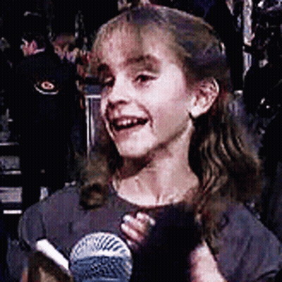 Little Girl Smiling Holding Microphone GIF