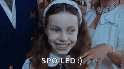 Little Girl Smiling Saying Spoiled Next To Man And Woman GIF