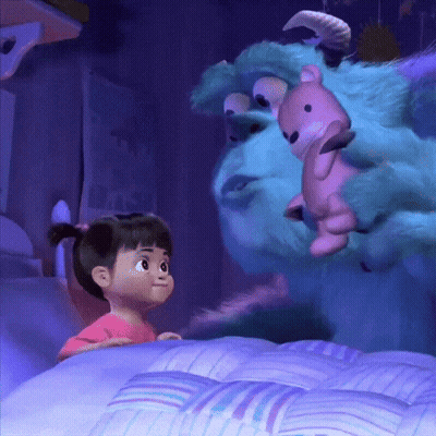 Little Girl Standing Next To Stuffed Animal In Bed GIF