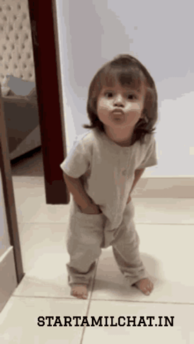 Little Girl Standing On Tiled Floor With Starttamilchat.in GIF