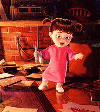 Little Girl Standing On Wooden Table In Pink Sweater GIF