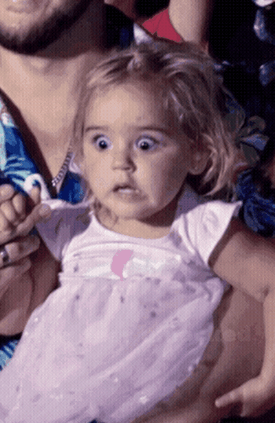 Little Girl Surprised Held By Man GIF