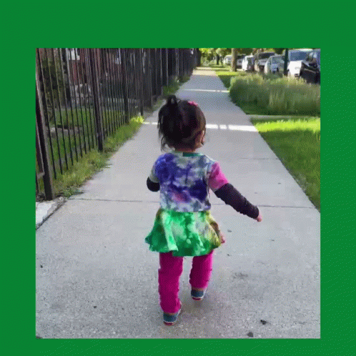 Little Girl Walking In Tie Dye Shirt And Pink Pants GIF