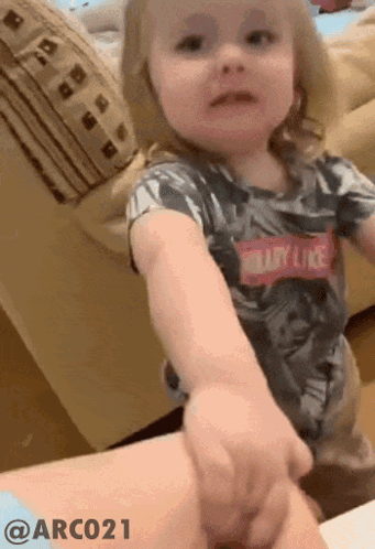 Little Girl Wearing Shirt That Says Baby Like GIF