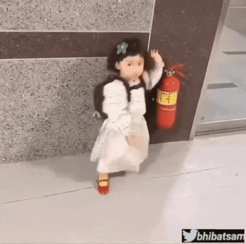 Little Girl With Backpack Holding Fire Extinguisher GIF