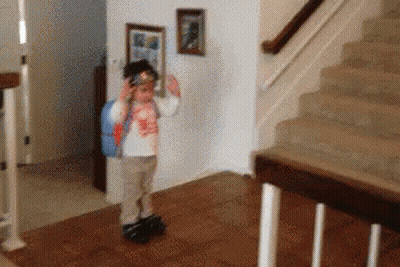 Little Girl With Backpack Near Stairs GIF