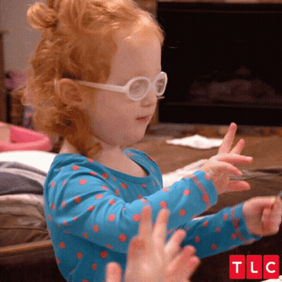 Little Girl With Glasses And Blue Polka Dot Shirt Clapping GIF