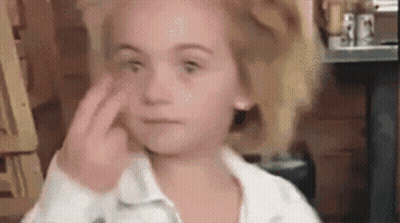 Little Girl With Glasses Sitting At Desk Netflix Logo GIF