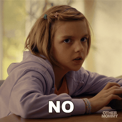 Little Girl With No On Shirt Sitting At Table GIF