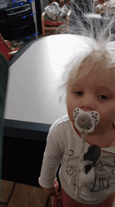 Little Girl With Pacifier And Dog Shirt GIF