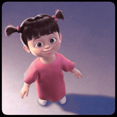 Little Girl With Pigtails and Pink Shirt Smiling