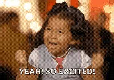 Little Girl With Pigtails And Tie Smiling Saying Yeah So Excited GIF