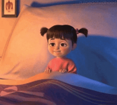 Little Girl With Pigtails Lying In Bed GIF