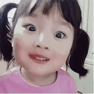 Little Girl With Pigtails Making Funny Face GIF