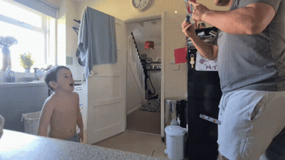 Little Girl With Purple Eyes Standing With Characters GIF
