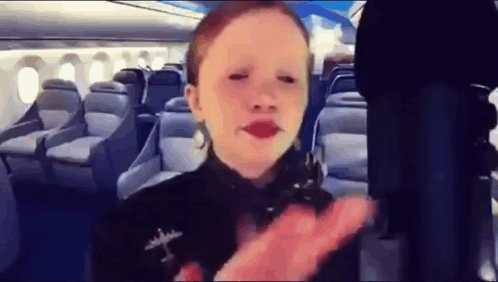 Little Girl With Red Lipstick On Airplane GIF