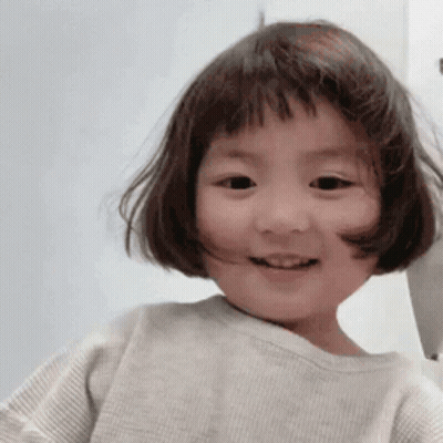 Little Girl With Short Brown Hair Smiling GIF