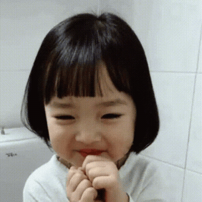 Little Girl With Short Hair And Bangs Making Funny Face GIF