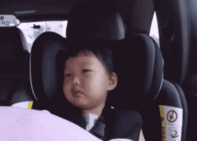 Little Girl With Yellow J In Car Seat GIF