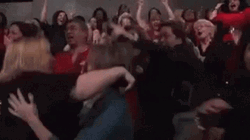 Lively Crowd Cheering And Hugging GIF