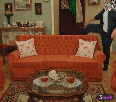 Living Room With Red Couch And Glass Coffee Table GIF