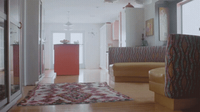Living Room With Rug And Yellow Couch GIF
