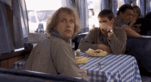 Lloyd Christmas Jim Carrey Scared Pointing GIF