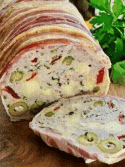 Loaf Of Meat With Olives And Cheese On Cutting Board GIF