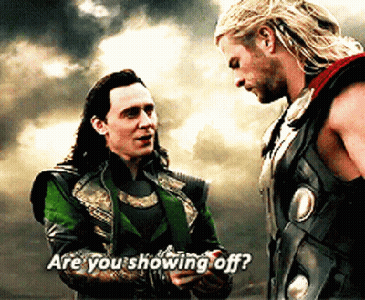 Loki And Thor Are Standing Next To Each Other And Thor Is Asking Loki If He 'S Showing Off GIF