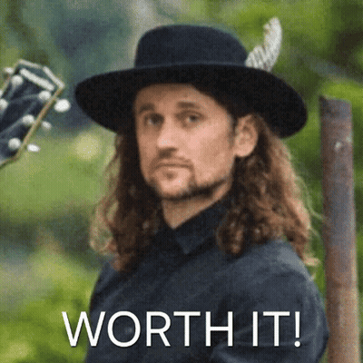 Long Hair Man In Black Hat Holding Guitar Saying Worth It GIF