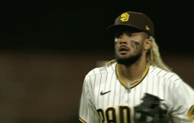 Long-Haired Baseball Player In Hat And Striped Shirt GIF