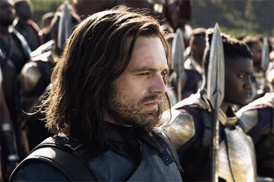 Long Haired Bearded Man Holding Spear Before Crowd GIF