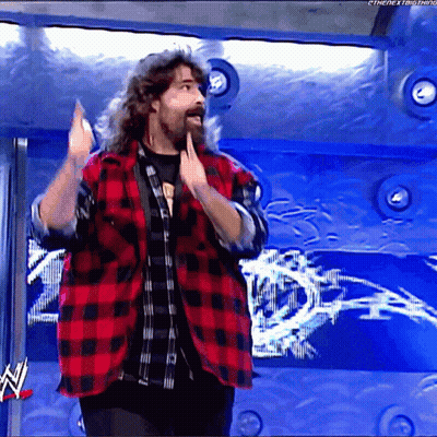 Long Haired Bearded Man In Red And Black Plaid Shirt At WWE Logo GIF