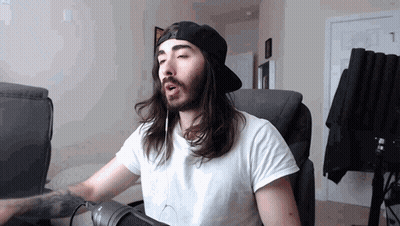 Long Haired Bearded Man Singing Into Microphone With Headphones GIF