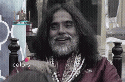 Long Haired Bearded Man Smiling At 10.30 Pm Sign GIF