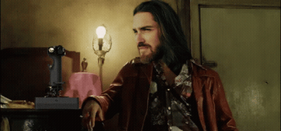 Long Haired Bearded Man With Remote Saying X GIF
