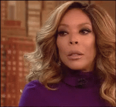 Long-Haired Blonde Woman Purple Sweater Funny Face GIF