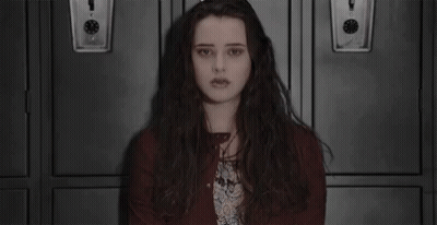 Long-Haired Girl Sitting In Front Of Lockers GIF