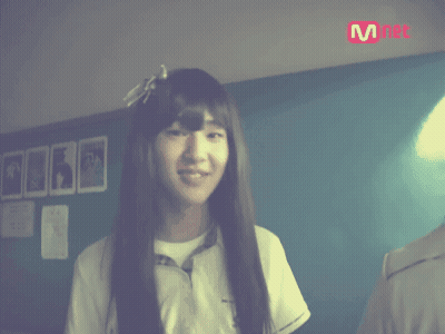 Long-Haired Girl Smiling At Mnet Sign GIF