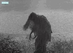 Long Haired Lady Spinning Around Monsoon Rain GIF