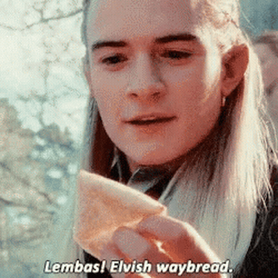 Long-Haired Man Holding Bread Saying Lembas Elvish Waybread GIF