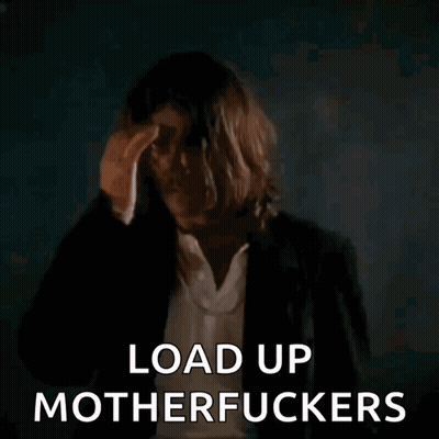 Long-Haired Man Holding Gun Says Load Up Motherfuckers GIF